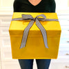 EverBox foldable yellow gift box laid flat to show collapsible storage design