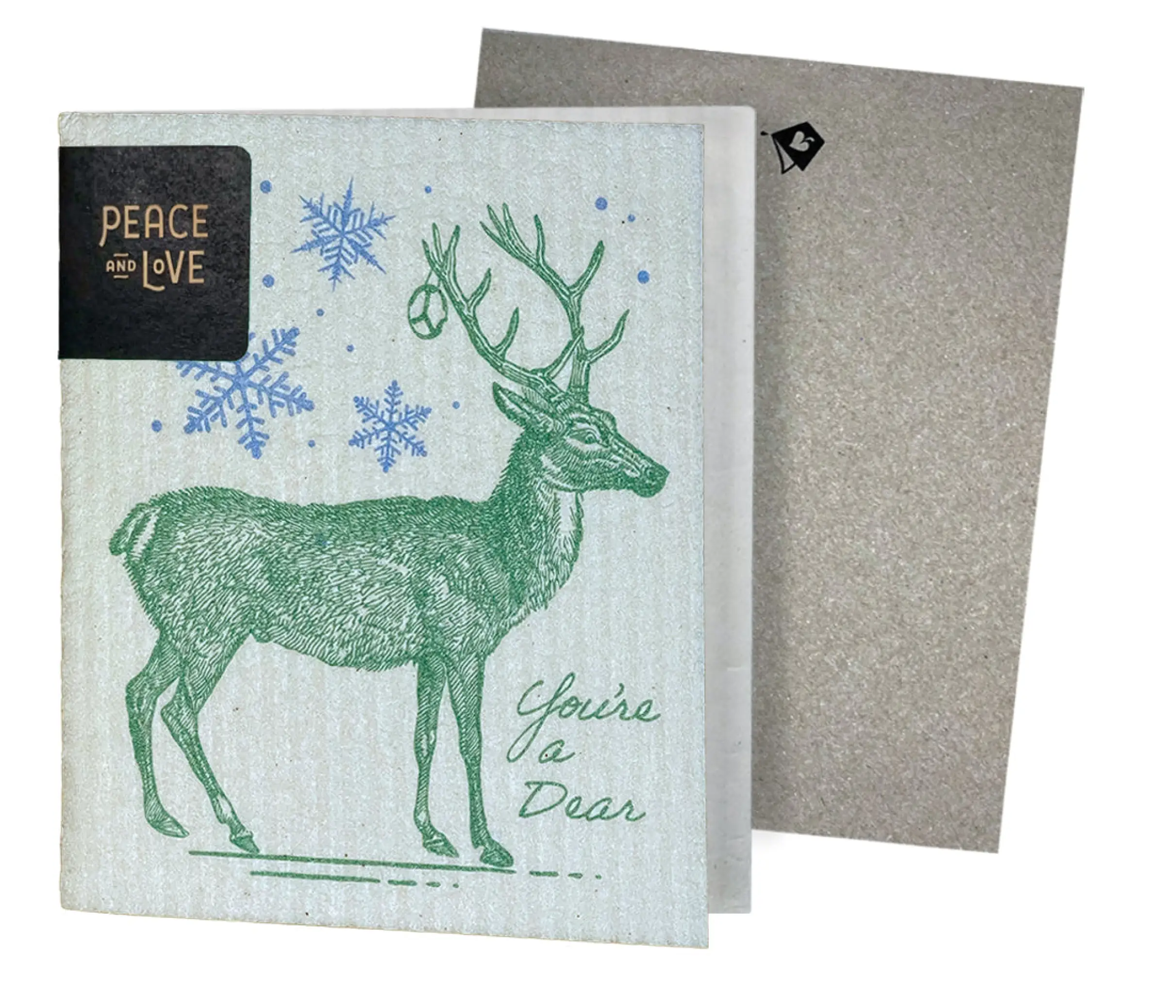 A reusable cleaning cloth with a deer design and the text 'You're a Deer', accompanied by snowflake patterns. The cloth is displayed partially unfolded next to a envelope.