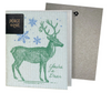A reusable cleaning cloth with a deer design and the text 'You're a Deer', accompanied by snowflake patterns. The cloth is displayed partially unfolded next to a envelope.