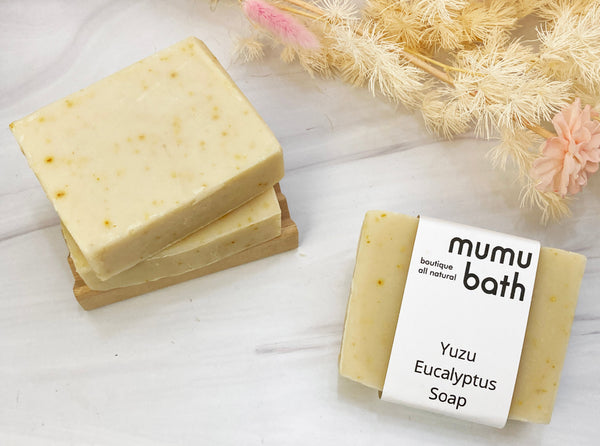 A close-up photo of the soap bar, showing its creamy texture and natural ingredients.