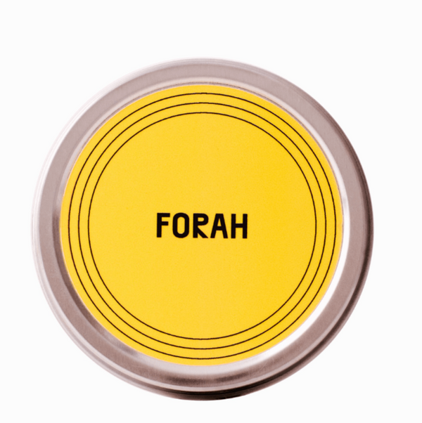 Round container with yellow label and 'FORAH' text on a white background