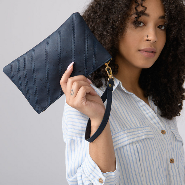Versatile cork wristlet for on-the-go essentials. Stylish, durable, and eco-friendly. Perfect for travel, work, or casual outings. Holds phone, keys, and more. Order now!