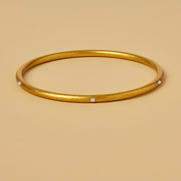 LOVE IS THE BOMB 7 DIAMOND BANGLE: A Symbol of Love, Peace, and Hope