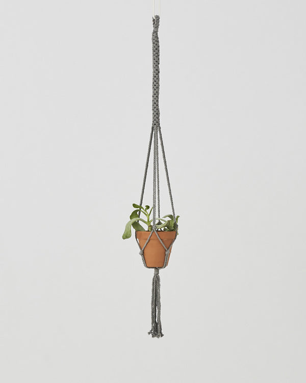 Eco-Friendly, handmade, and Fair Trade Plant holder Rustic, durable, and expansive, like the beautiful coasts of Bluefields in Nicaragua.  This plant holder is perfect for patios or large windows, but its simple design and cotton fringe make it a perfect addition to any space.