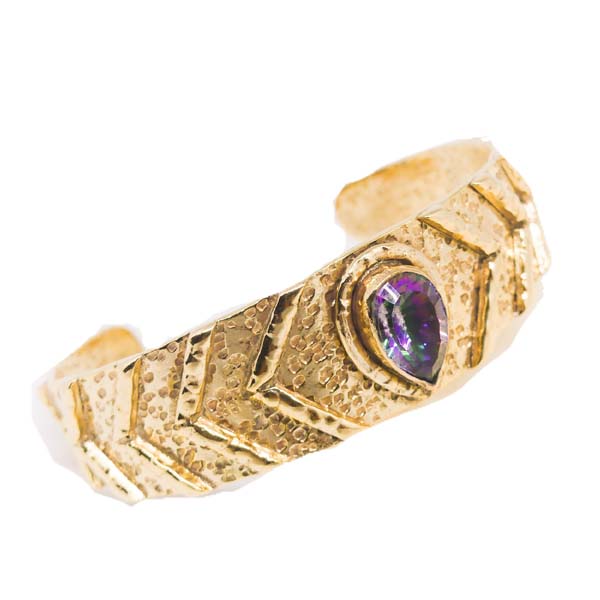 Discover the mystical beauty of our handcrafted Mystic Topaz Bangle. This unique and sustainable piece is made with love and care, using recycled metals and ethically sourced gemstones. Elevate your style and empower your spirit with this stunning accessory.