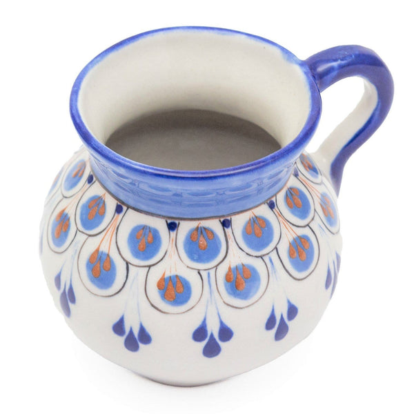A photo of the handpainted Guatemalan pottery mug in assorted colors