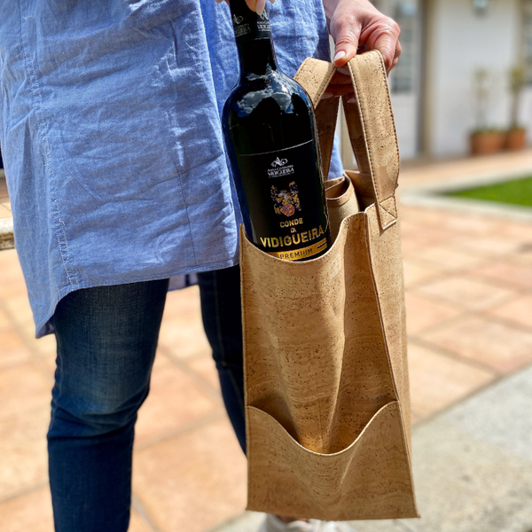 Stylish and sustainable cork wine tote for four bottles. Perfect for wine lovers and entertaining. Handmade in Portugal. Eco-friendly, durable, and lightweight. Order now!