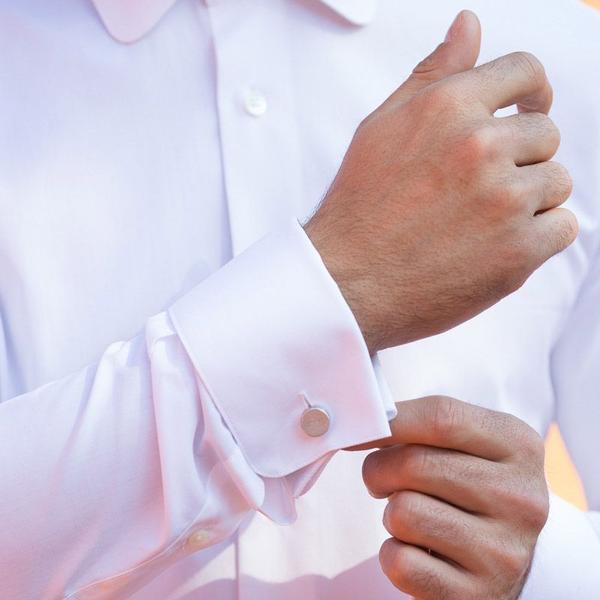 A photo of the Halo Circle Cufflinks on a man's wrist