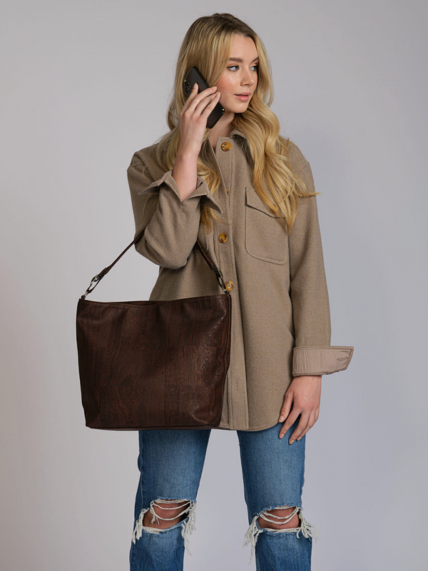 Unleash your inner stylist with this spacious, boho cork shoulder bag! Organize your chaos in style with multiple compartments, laptop-friendly space, and effortless charm. Sustainable, versatile, and oh-so-comfortable, it's your eco-chic everyday companion.