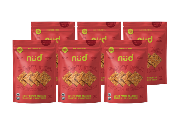 Five packages of nud crackers on a white background