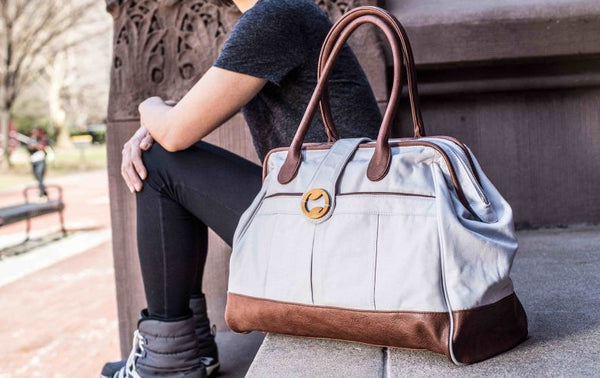 The Cassia Weekender Bag: Eco-friendly & versatile! Made with organic cotton & eco-friendly dyes, this spacious bag transitions from weekend travel to gym duffle or diaper bag. Perfect for everyday