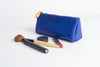 Elevate your essentials! Chic Union Pouch - vegan leather, orange lining, stands up, holds makeup, pens, brushes. Perfect gift set option. Shop sustainable accessories now!