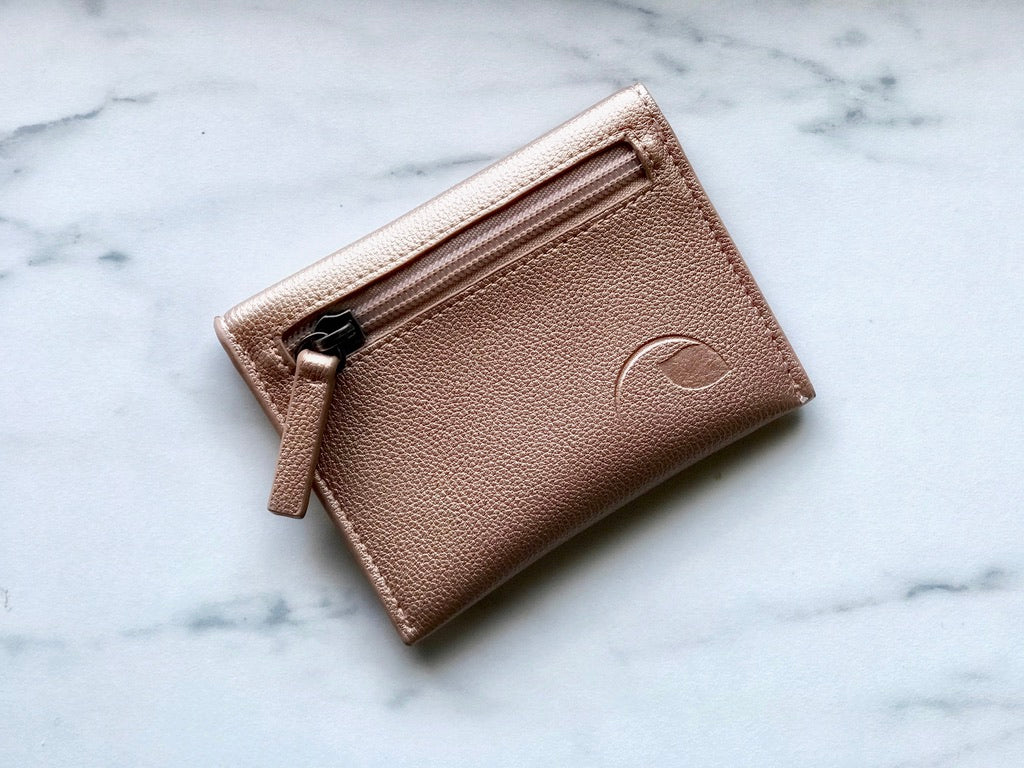 Compact & chic! Baltic Coin Wallet - leather, card & coin organizer, holds 20 cards or 10 credit cards, zippered pouch, orange lining. Black & rose gold. Shop stylish wallets now!