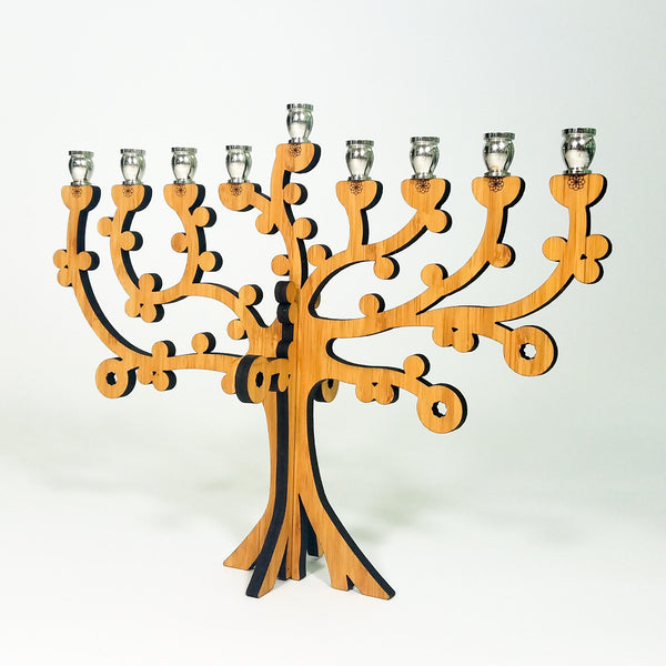 Add a touch of nature and meaning to your Hanukkah celebrations with our eco-friendly Tree of Life Menorah. Made from sustainable bamboo and featuring a beautiful design, this menorah is perfect for any occasion. Order yours today!