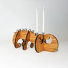 Add a touch of whimsy to your Hanukkah celebrations with our Swirl Menorah. Made from sustainable bamboo and featuring a unique design, this menorah is perfect for home use or travel. Order yours today!