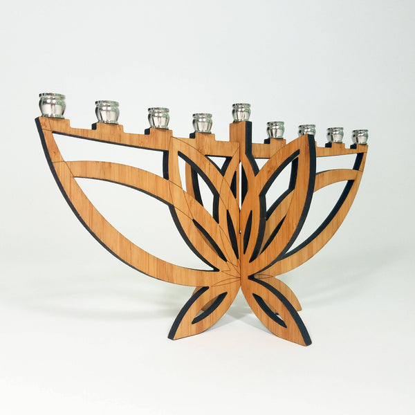 Add a touch of elegance and sustainability to your Hanukkah celebrations with our Mini Lotus Flower Menorah. This compact and portable design is perfect for travel or limited space. Order yours today!