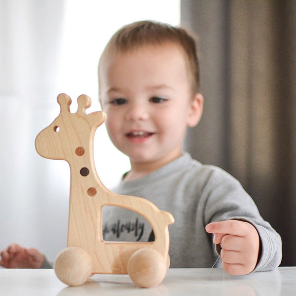This wooden giraffe push toy is a beautiful and unique gift for any child. It's made from high-quality materials and it's sure to last for years to come. 