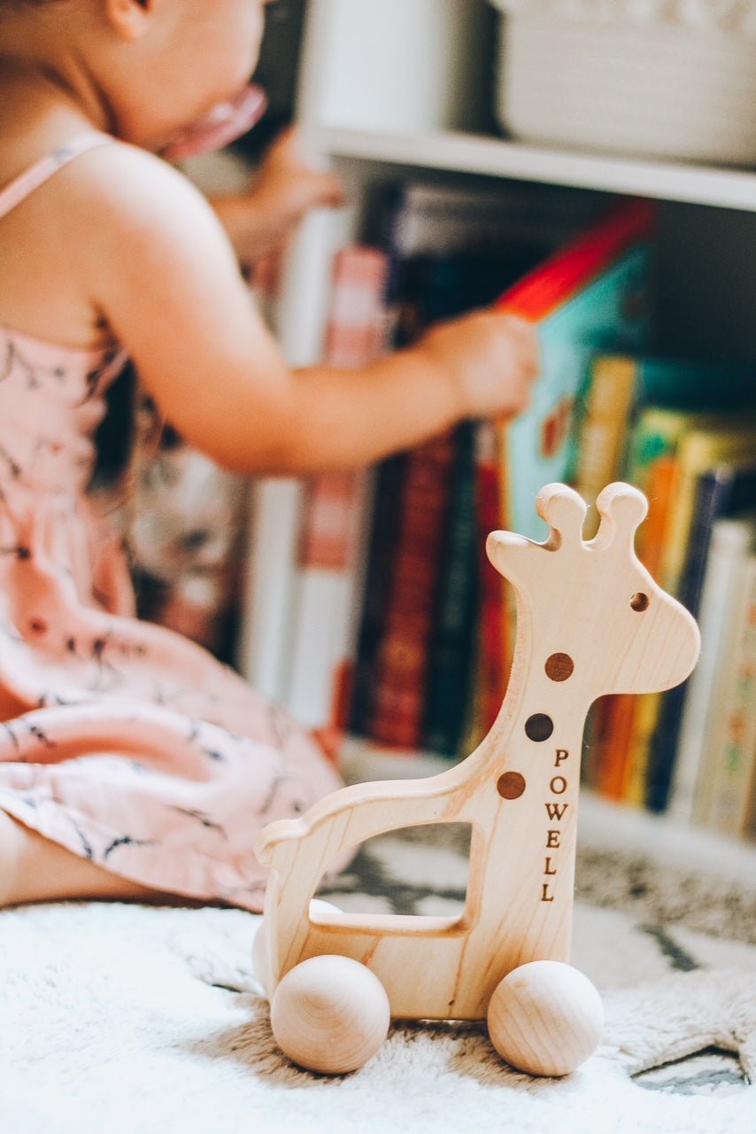 This wooden giraffe push toy is a beautiful and unique gift for any child. It's made from high-quality materials and it's sure to last for years to come. 
