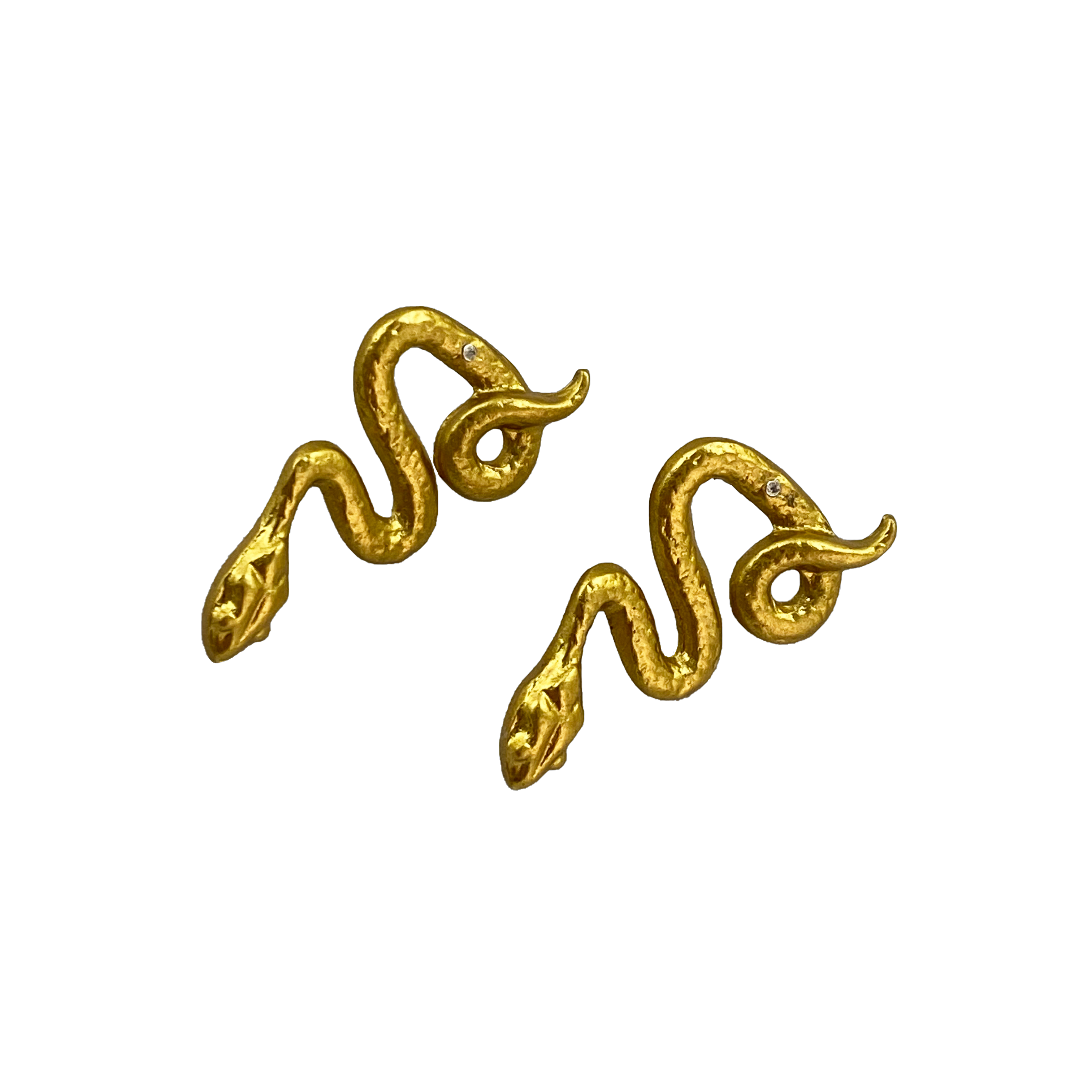 Elevate your style with Gold Tone Snake Earrings by Beatrix Ost. Symbolizing transformation, these statement pieces support Laotian artisans and MAG's de-mining efforts. Shop now for a unique blend of style, symbolism, and social responsibility.