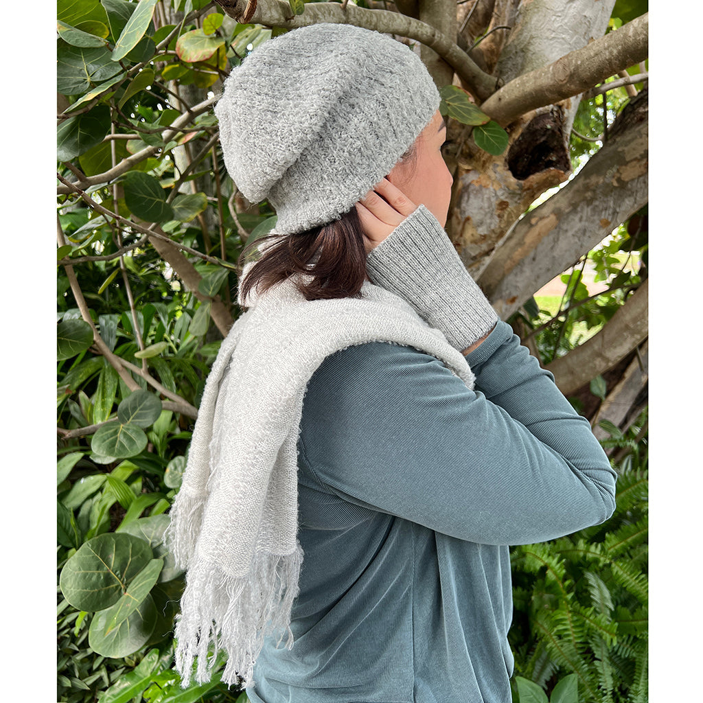 Wrap yourself in luxury with our Gray Loop Knit Alpaca Scarf. Crafted from sustainable alpaca wool, this scarf is incredibly soft, warm, and stylish. Perfect for any occasion, our scarf is a must-have for the eco-conscious fashionista. Shop now and experience the difference!