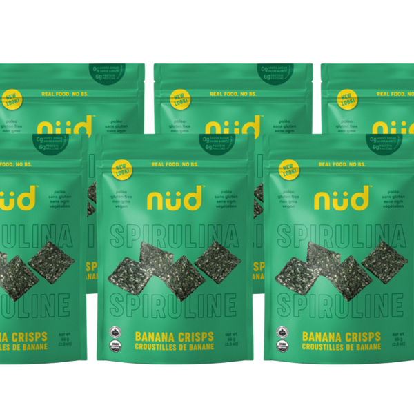 Multiple packages of nud Spirulina Banana Crisps on a white background