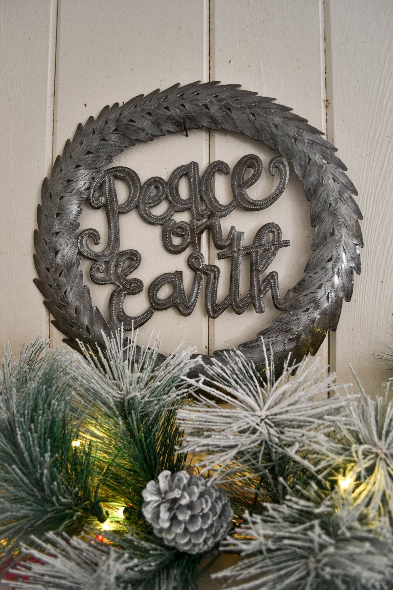 Handcrafted Recycled Steel Holiday Wreath - Spread the joy and peace of the season with this unique and sustainable piece of art.