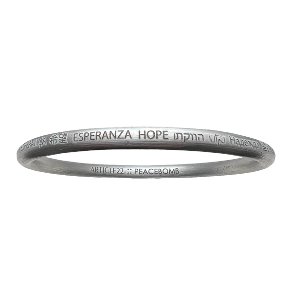 Wear the world's languages on your wrist with the HOPE All Around Bangle. Support peace, sustainability, and Laotian artisans. A meaningful and stylish accessory.