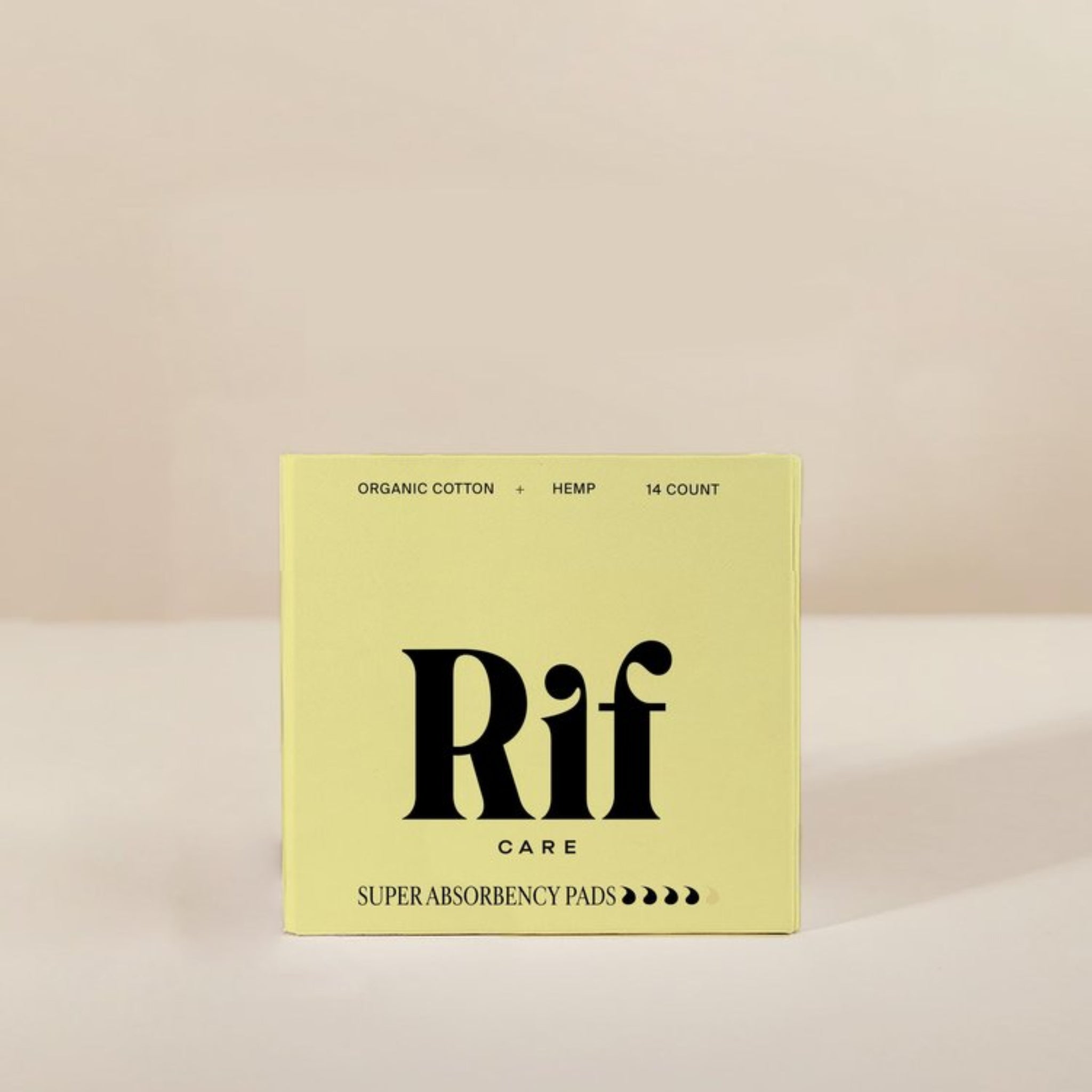 Yellow box of Rif Care super absorbency pads on a beige background