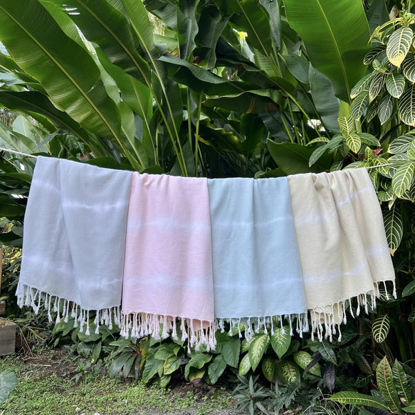 Indulge in the ultimate beach luxury with the Blush Tie Dye Turkish Beach Towel! Handcrafted from soft, absorbent Turkish cotton, this oversized towel is perfect for the beach, pool, or travel. Unique tie-dye design, eco-friendly materials. Shop now and experience the difference!