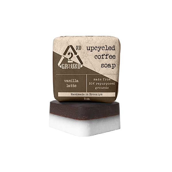 A close-up photo of the Coffee Soap bar, showing its coffee grounds and creamy texture. Description: Our Coffee Soap is made with all-natural ingredients, including coffee grounds, coconut oil, and shea butter. It is perfect for exfoliating and moisturizing your skin. vanilla latte