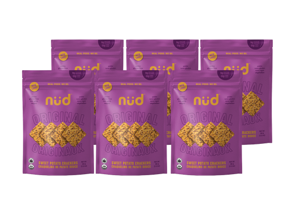 Five packages of nud Original Sweet Potato Crackers on a white background