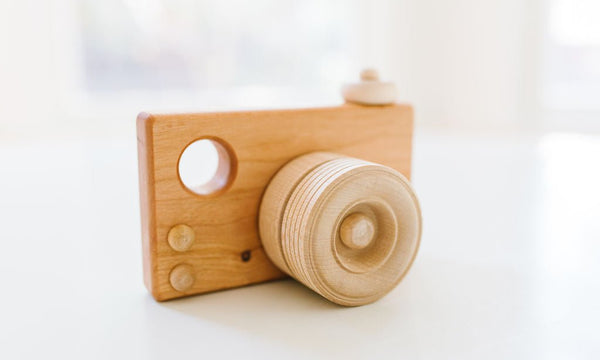 This wooden toy camera is a fun and educational toy for kids of all ages. It's made from sustainably sourced wood and features a realistic shutter sound and flash. Kids will love pretending to be photographers and taking pictures of their friends and family.